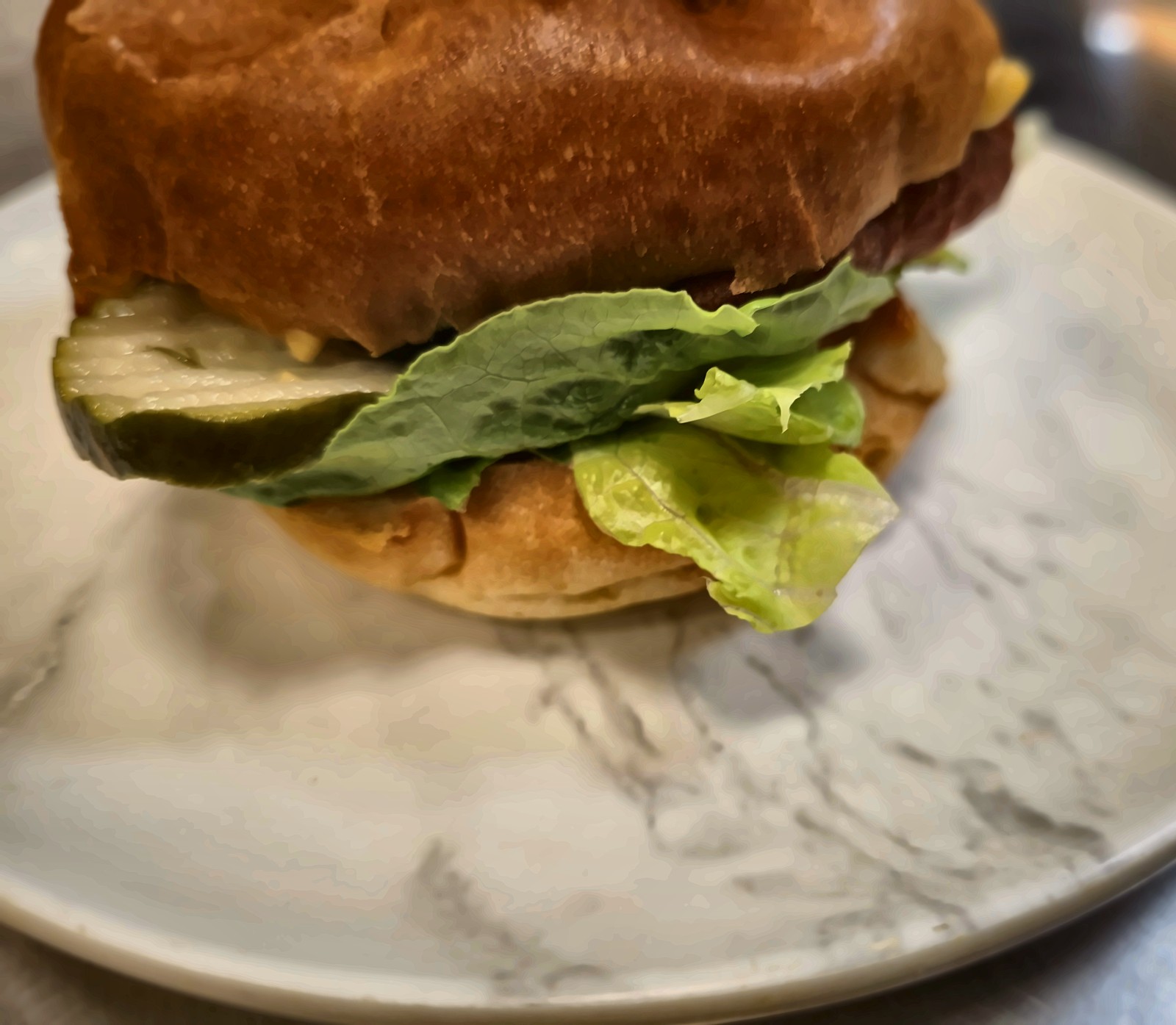 Fresh lettuce and house-made pickles layered over a crisp akara patty.