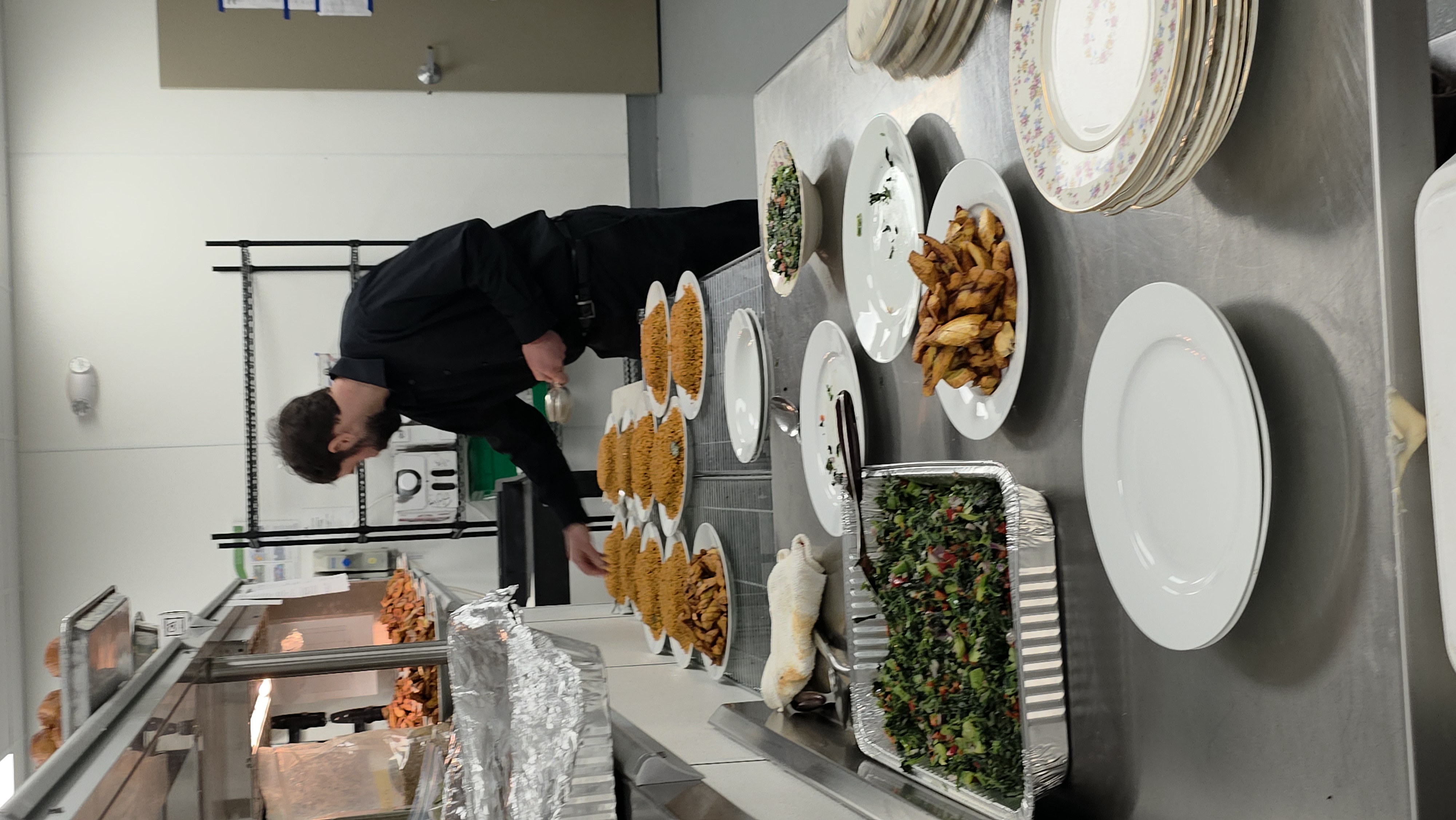 Ufondu Kitchen chef preparing a catering spread