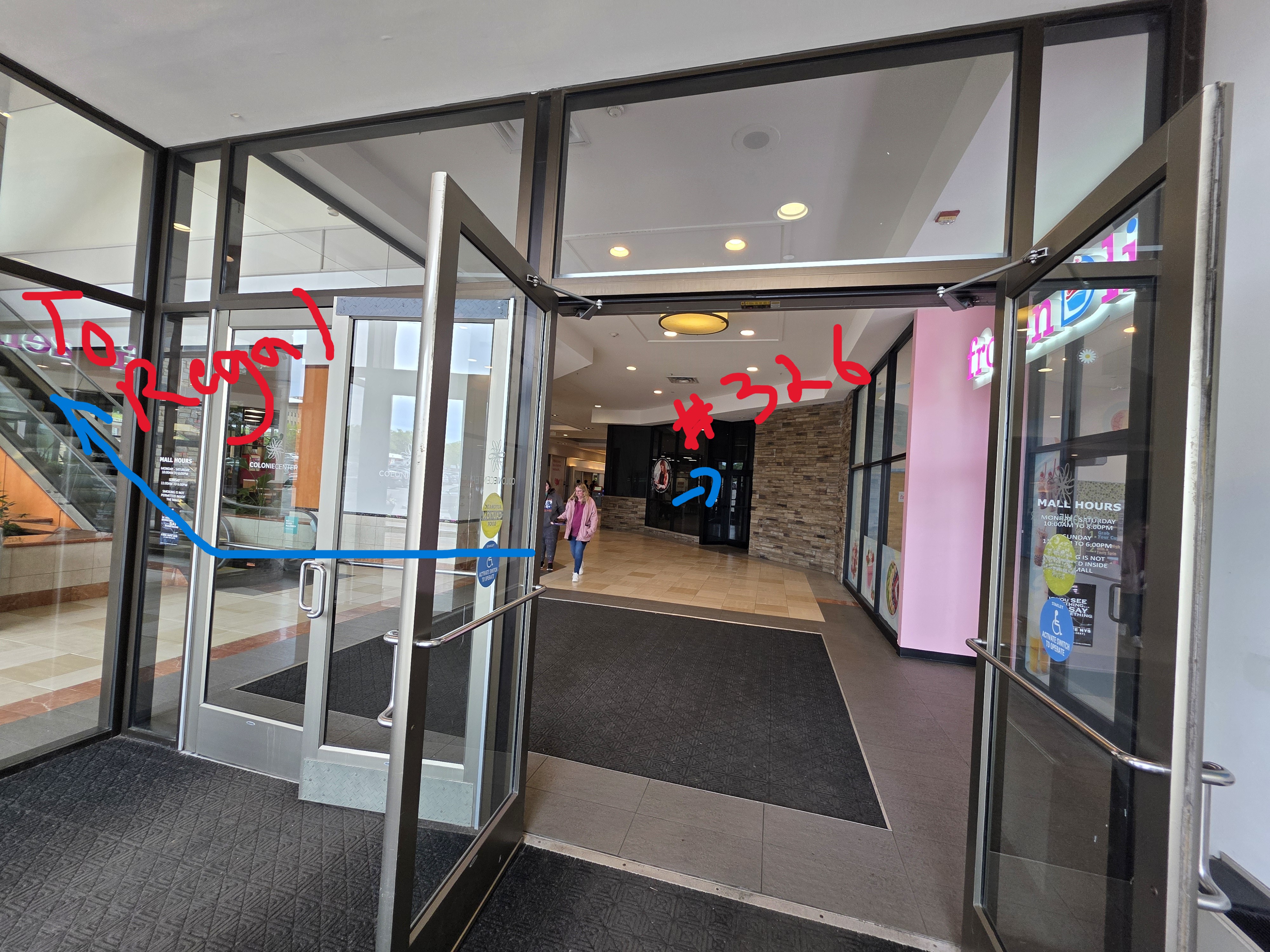 The Colonie Center entrance by the Regal Cinema — Ufondu Kitchen is just inside, opposite Five Guys.